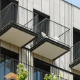 Polymer Concrete Facade in Vertical Slat Home