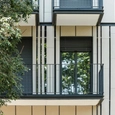 Polymer Concrete Facade in Vertical Slat Home