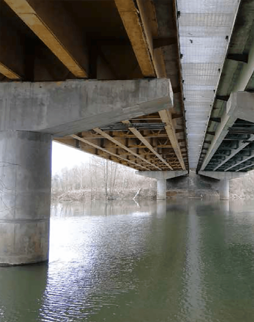 Structural strengthening with CFRP plates and FRP fabrics