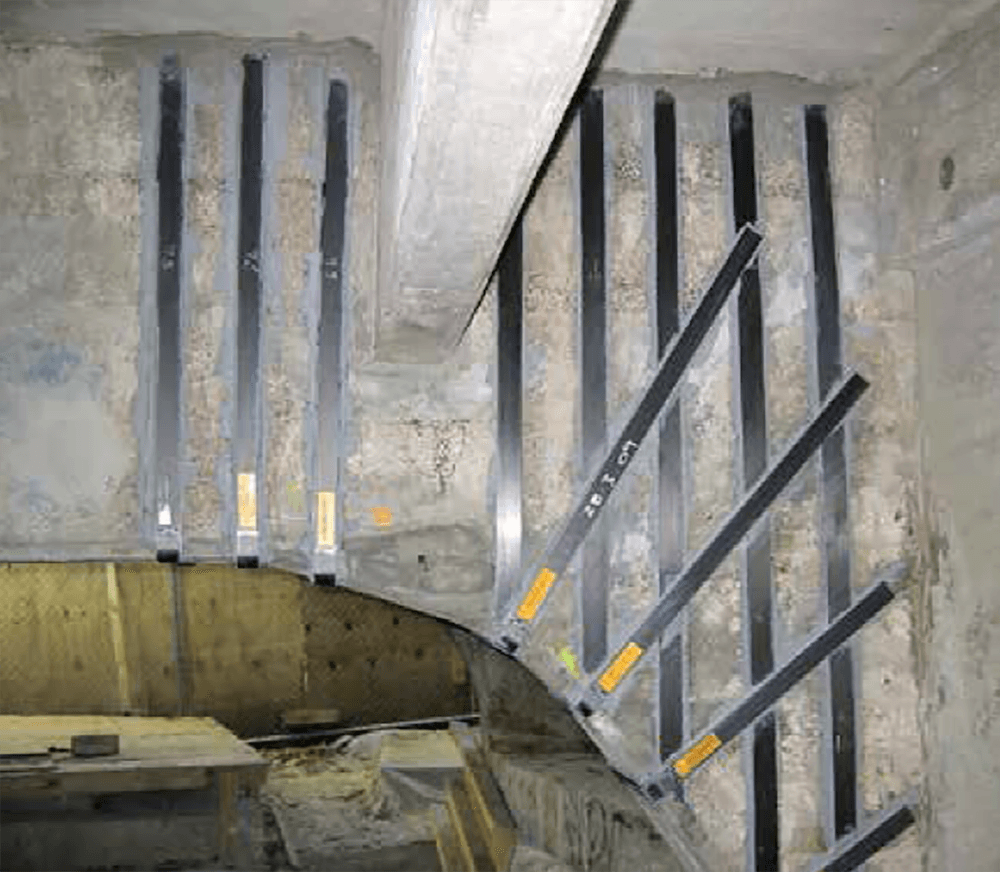 Structural strengthening with CFRP plates and FRP fabrics