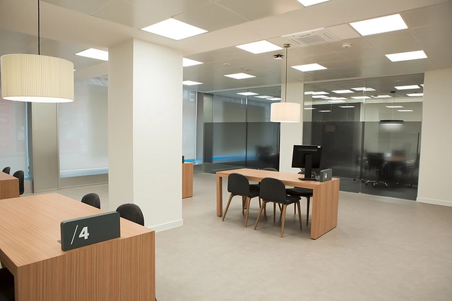 Rollglass+ sliding system from KLEIN creates partitions for meeting rooms in office space