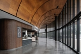 Curved Wooden Soffit in the UT Moody Center Arena