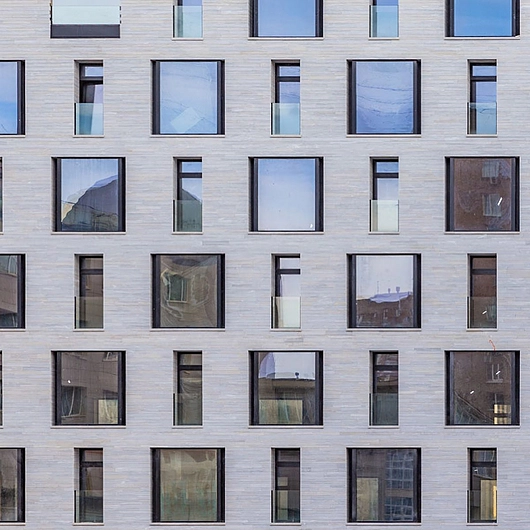 Facade cladding in Silver Cloud marble