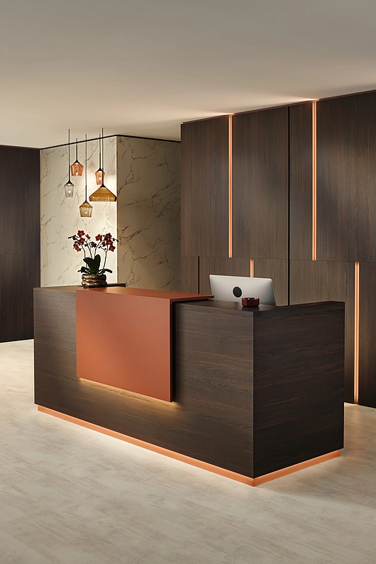 EGGER Rusty Red U335 ST9 as accent for reception area, with Crystal Marble F800 ST9 on the wall