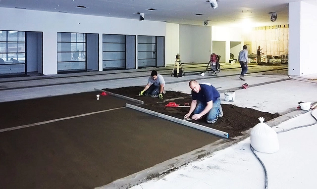 Proccess of DITRA membranes application on the floor levelling of the car showroom