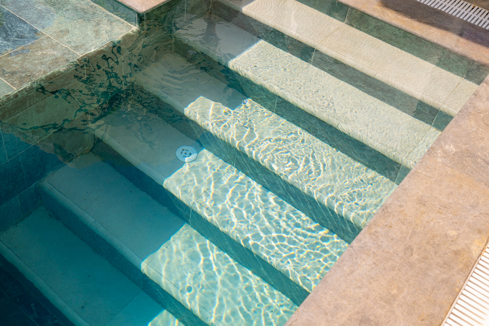 Natural-Toned Tiles in Hotel Pool
