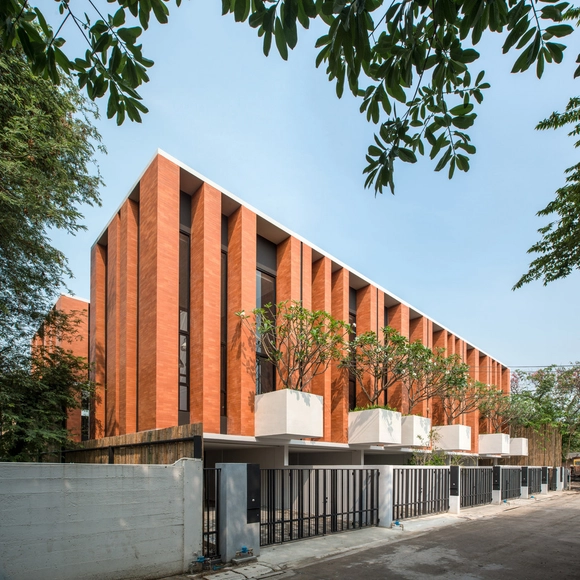 Townhouses with Private Courtyards / baan puripuri - Housing