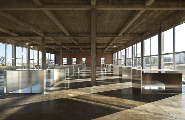 How Donald Judd's 100 Shimmering Aluminum Boxes Light Up the Chinati Foundation - Featured Image