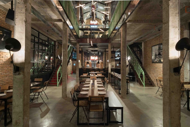 Industrial Brewery Pub In Saigon  / T3 ARCHITECTS - Interior Photography, Interior Design, Door, Arch, Beam, Table, Chair