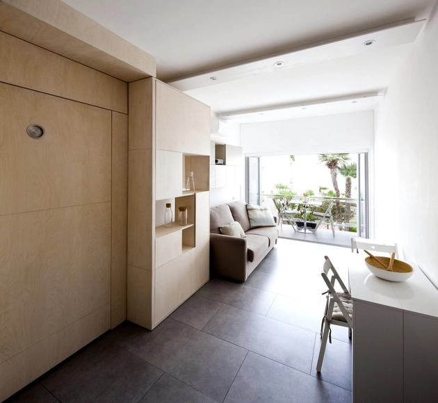 Este mueble adapta su geometría para cumplir distintos usos en un espacio de 20 m2 - Imagen Principal
