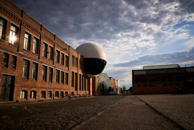 An Oscar Niemeyer-Designed White Concrete and Glazed Sphere, Generates Extension for a Factory Canteen in Germany - Featured Image