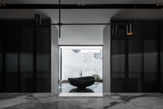 Low-Light Bathrooms That Swaddle You With Darkness - Featured Image