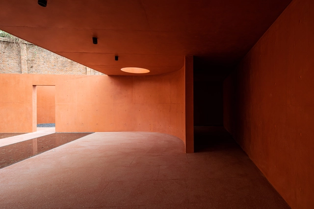 More Than Gray: 15 Projects That Explore Red Pigmented Concrete - Featured Image